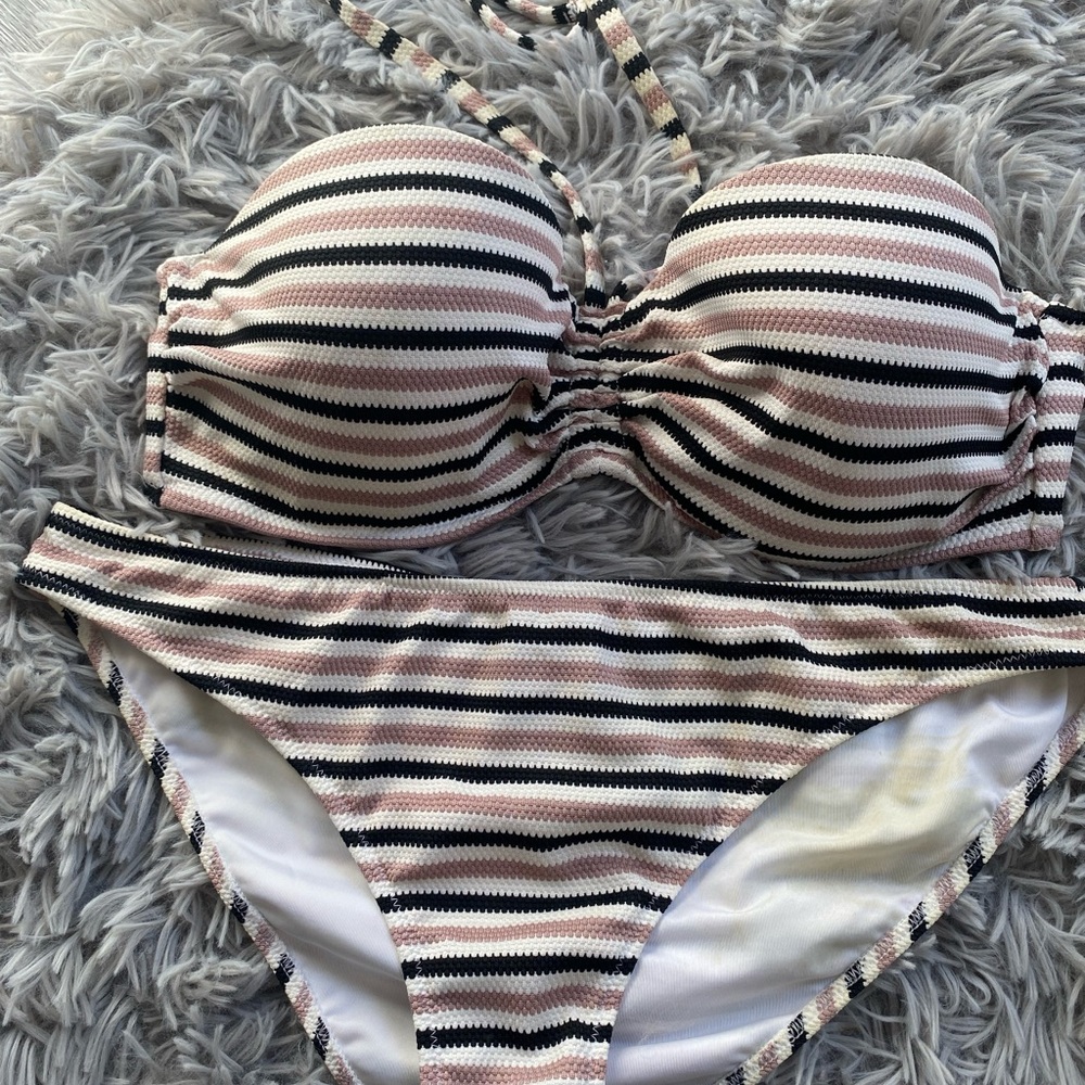 Worn twice. Stain inside of bikini bottom from sunscreen. Bikini top 34D